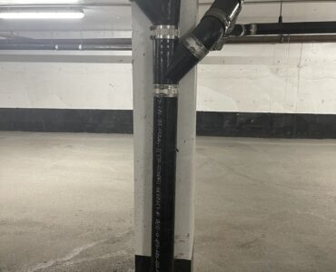 Cast iron drainage piping in a parking garage